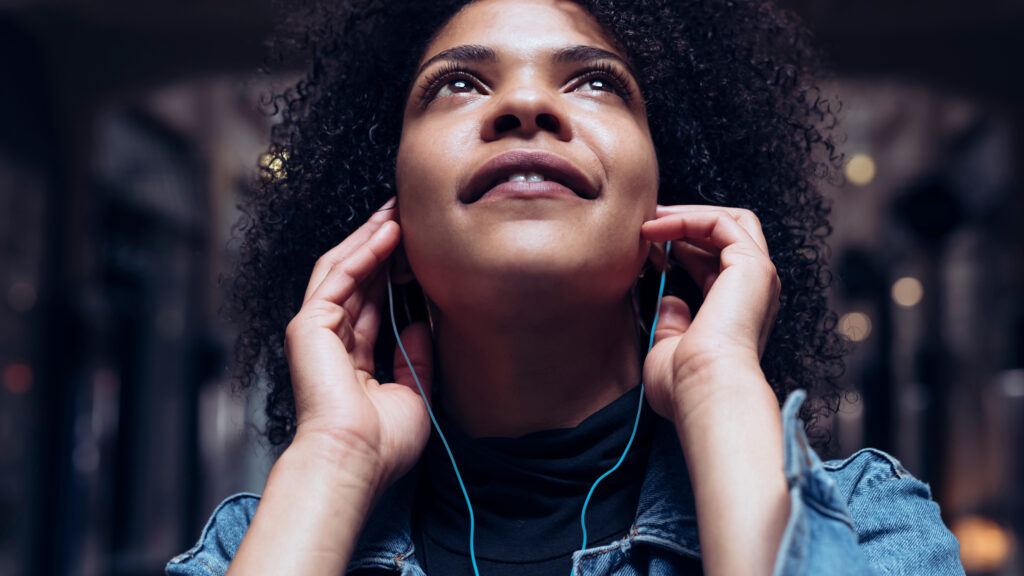 Southeastern podcast campaign image of woman listening through earphones.