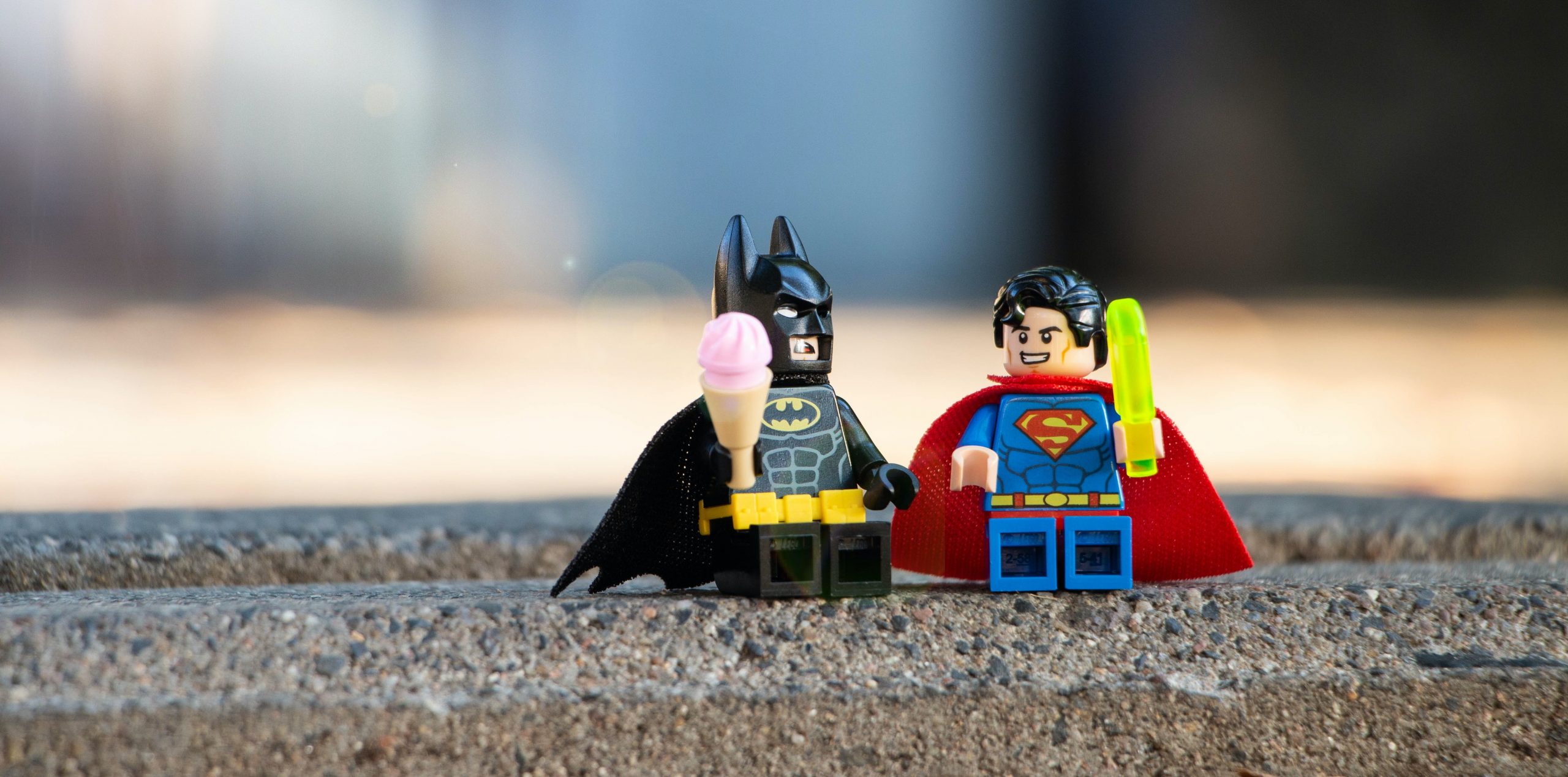 lego figures of batman and superman being used to represent a blog about employer brand